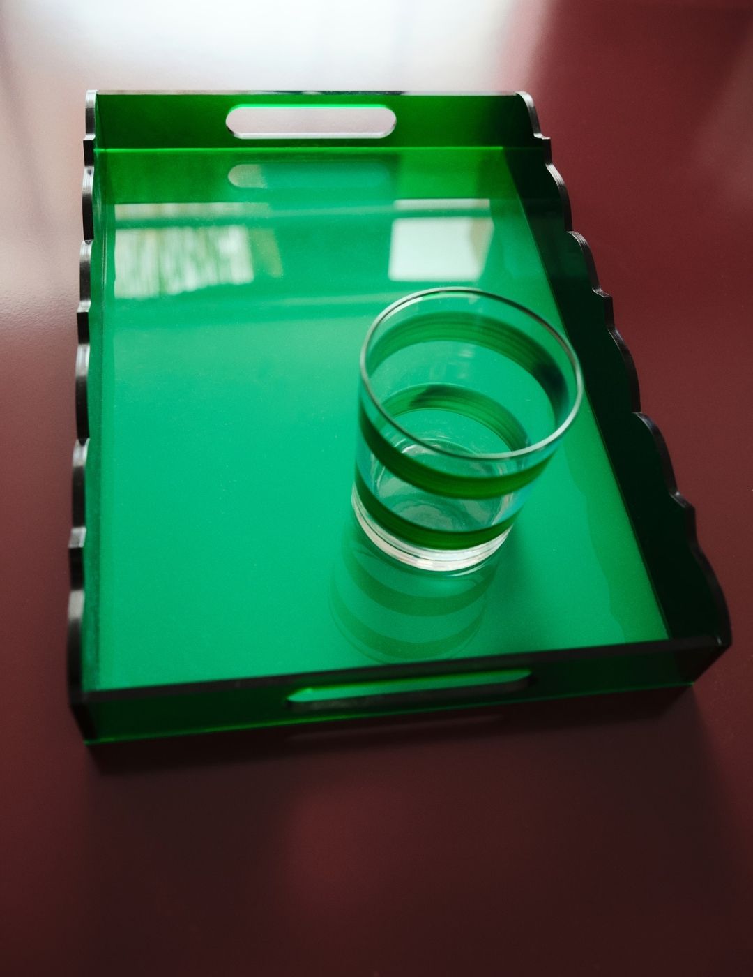 Medium Wave Acrylic Tray in Colour on bordeaux lacquered table.