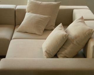 Close up of neutral couch and cushions