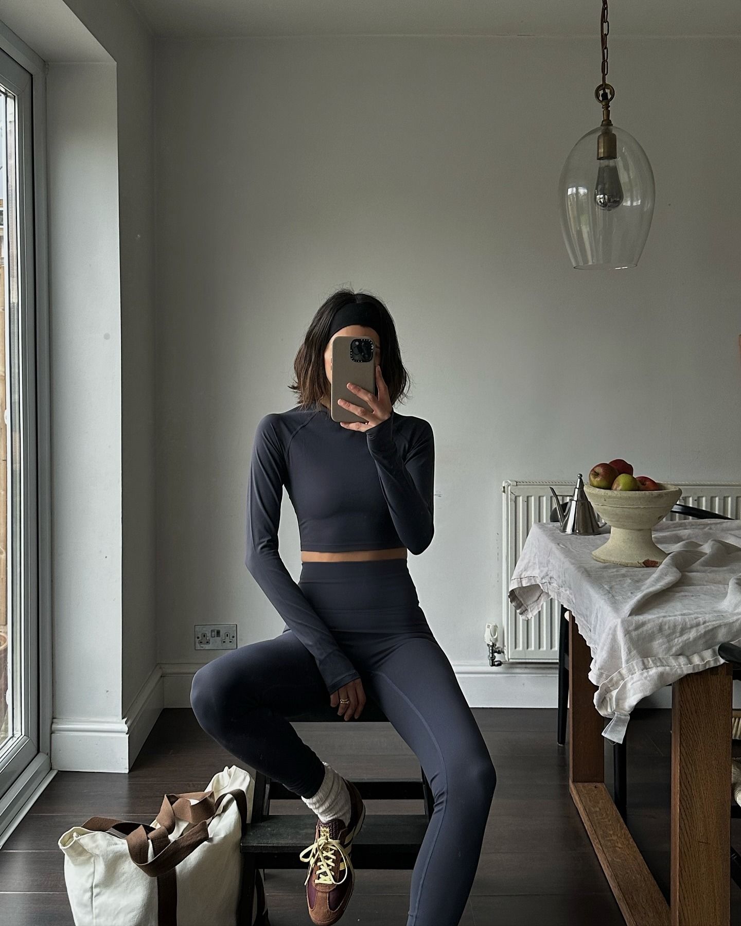 Creator @_santinaharrison taking a mirror selfie wearing workout gear