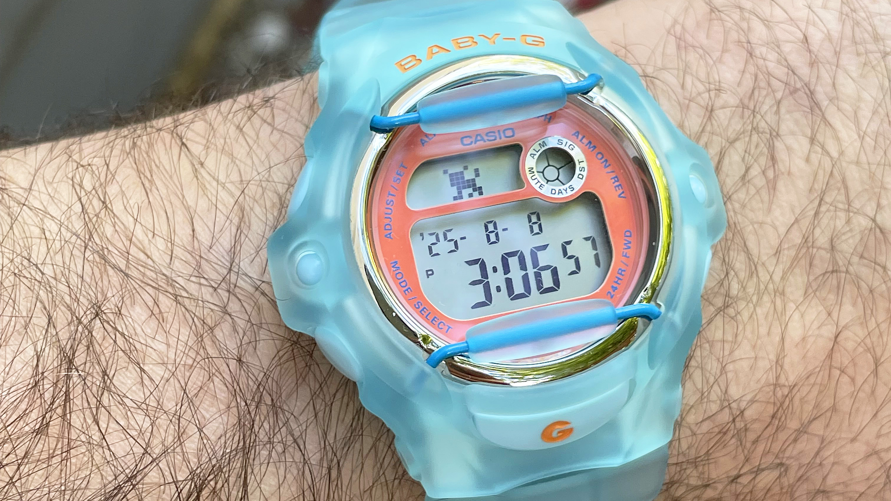 Close-up of the Casio Baby-G BG169 is semitransparent baby blue on the writer's wrist