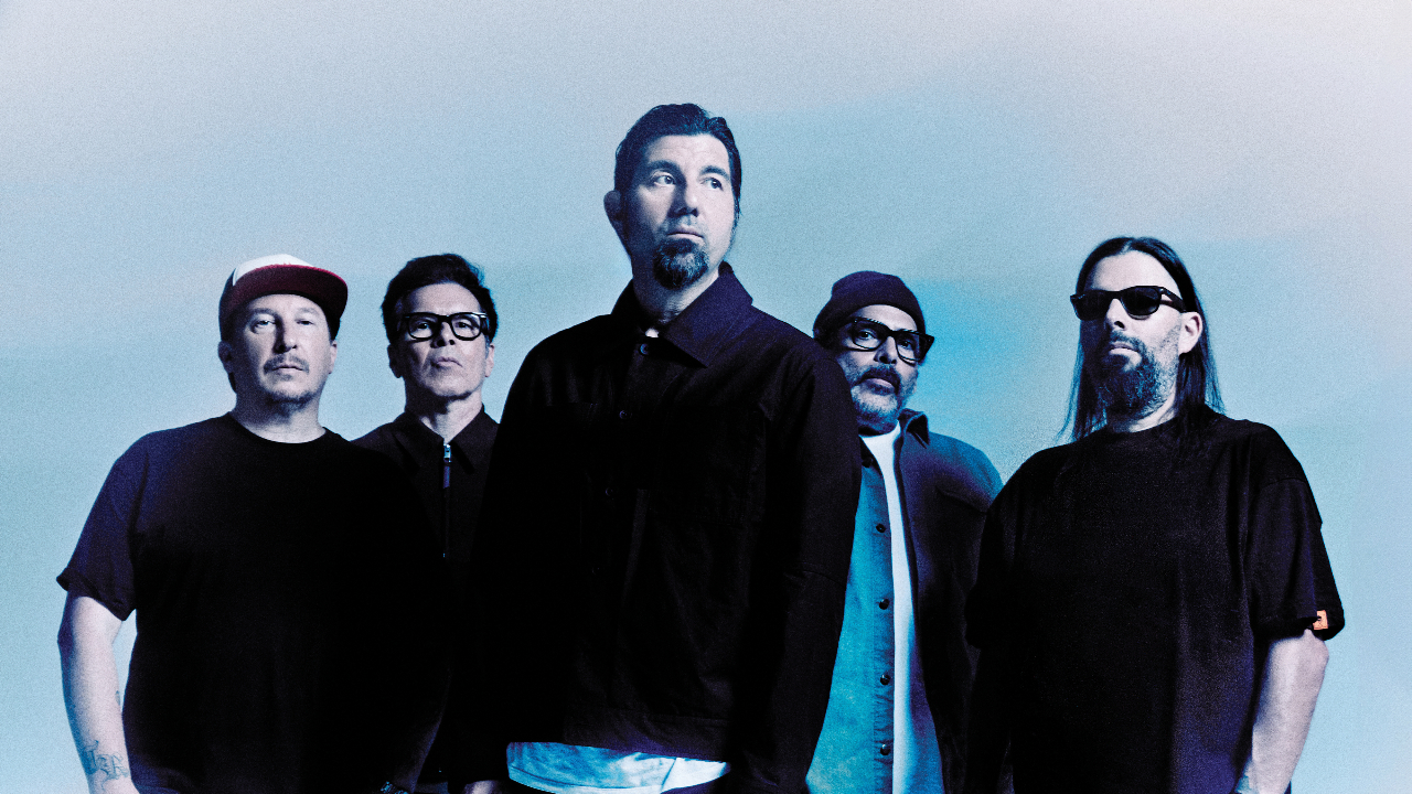 Deftones looking serious against a light blue backdrop