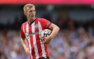 Southampton midfielder and captain James Ward-Prowse holding the ball