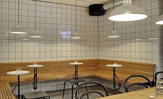 Wooden wall seating and tiled walls