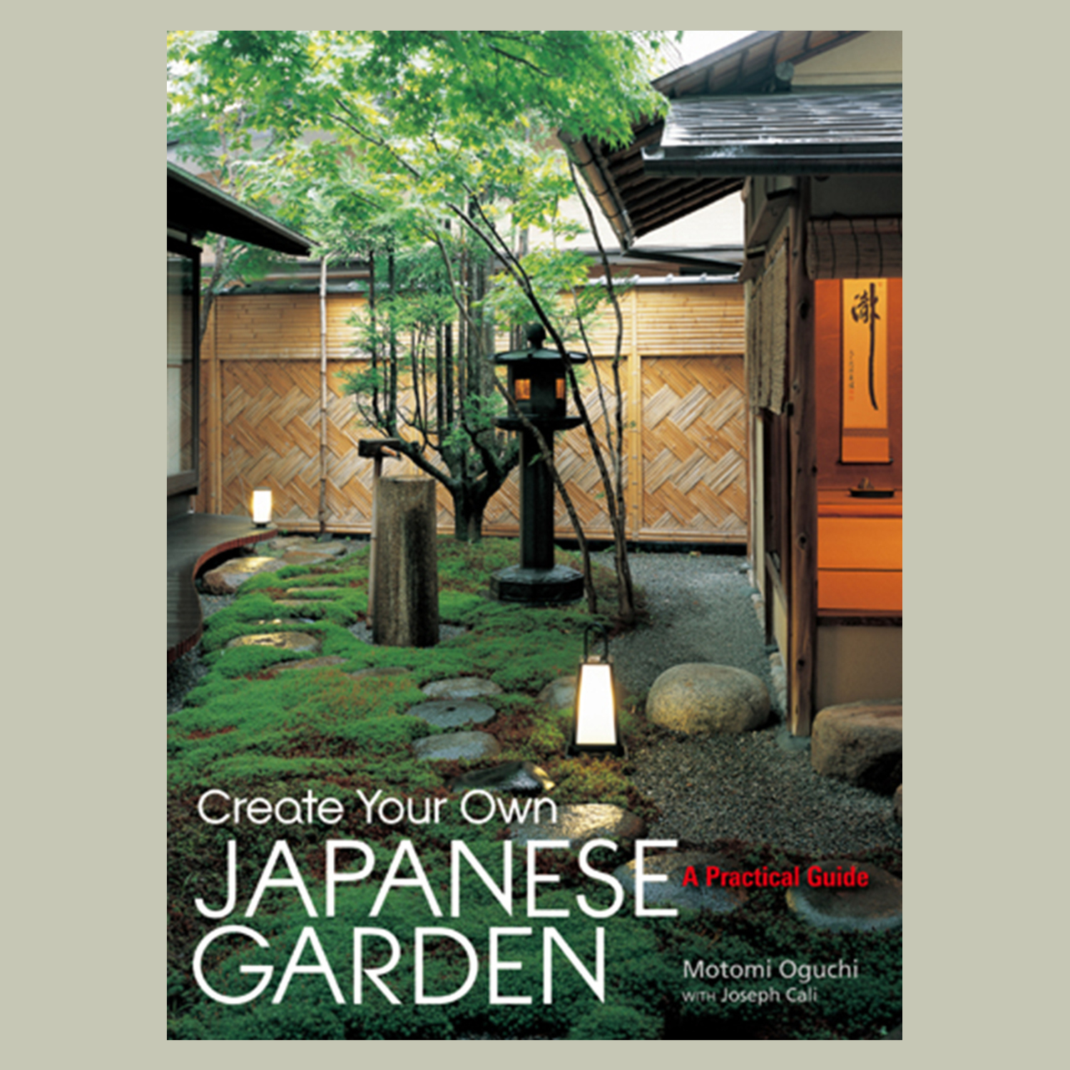 A hardcover book titled 'Create Your Own Japanese Garden' by Motomi Oguchi
