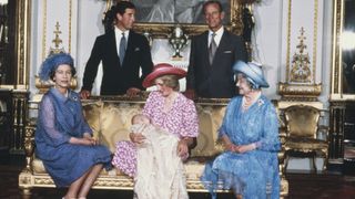 Princess Diana holding Prince William, pictured alongside Queen Elizabeth, the then Prince Charles, Prince Philip and Queen Mother