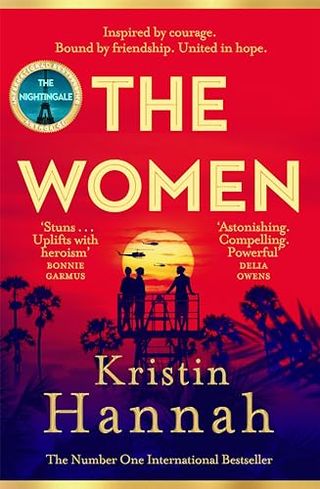 'The Women' book cover of a red sky and women standing on a platform looking at helicopters in the distance