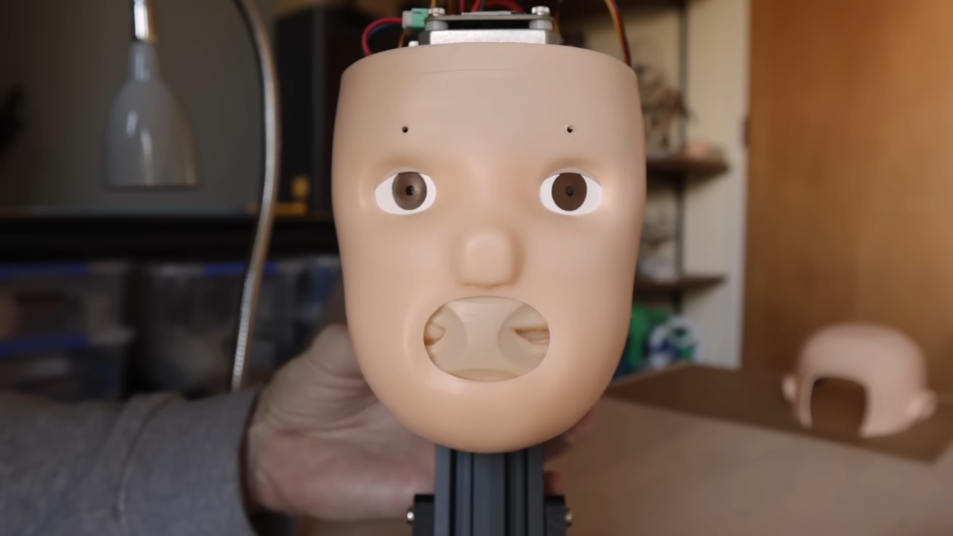 An animatronic doll&#039;s head full of mouths, because we have strayed far from God&#039;s light