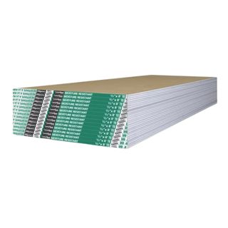 Stacked white drywall panels with green logo on packaging spanning edges close to the front of the shot