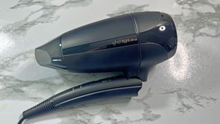 GHD Flight+ hair dryer with the handle folded