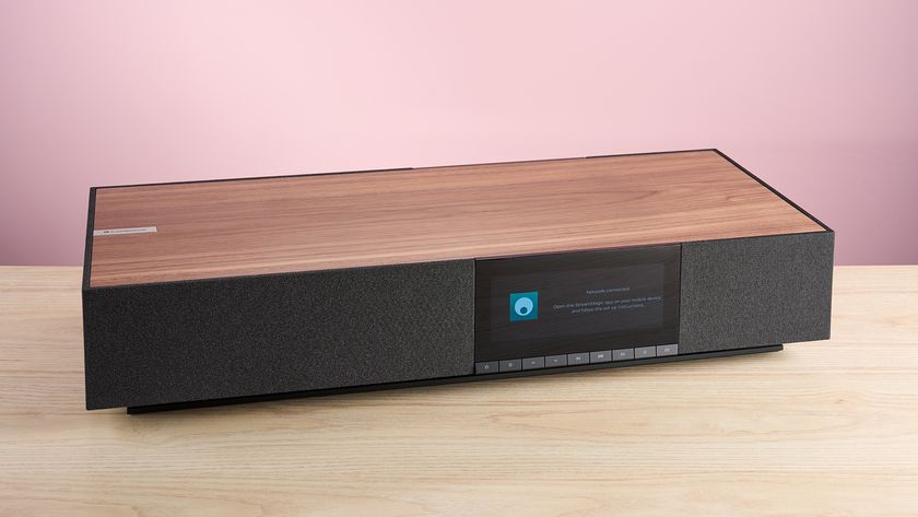 The Cambridge Audio Evo One at a 3/4s angle on a worktop in front of a pink background.