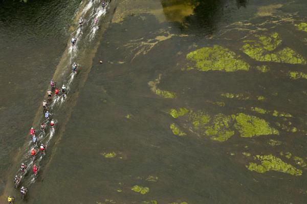 Riders cross the Bree River during stage 2 of the Cape Epic