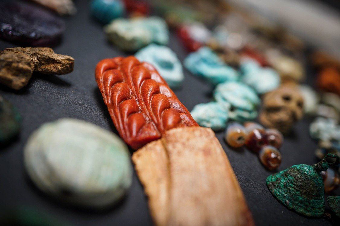 Each of the amulets is intricately carved.