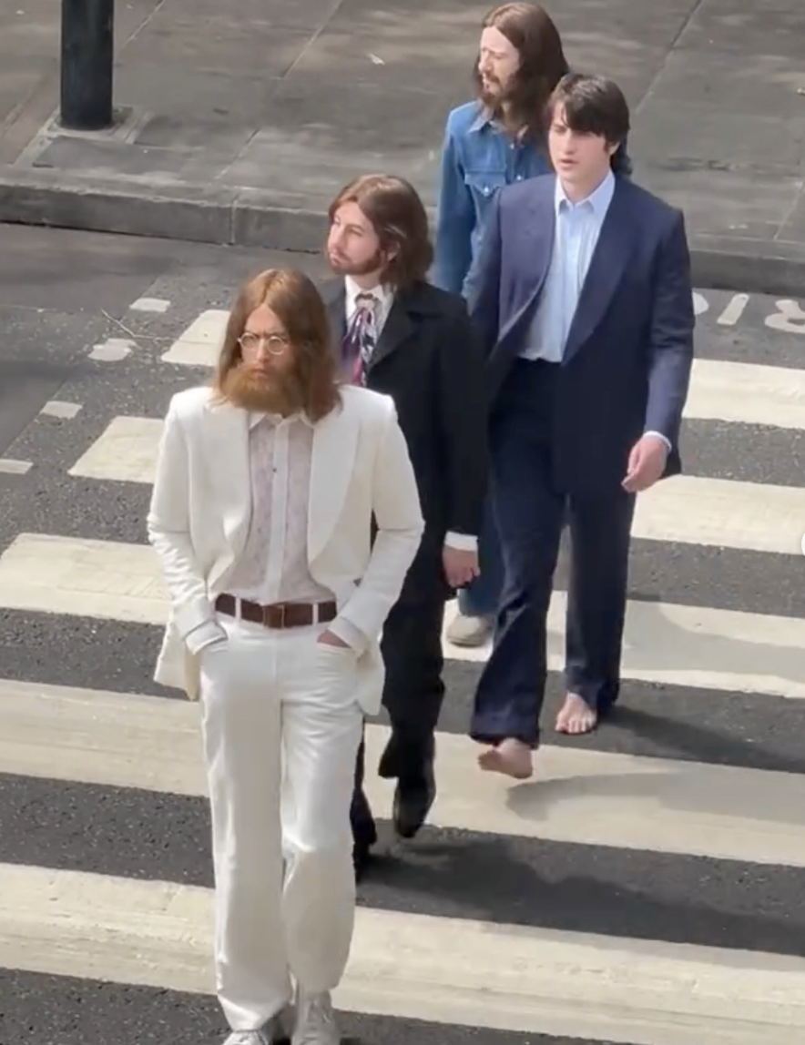 an image of the four actors playing the beatles at the crossing in London