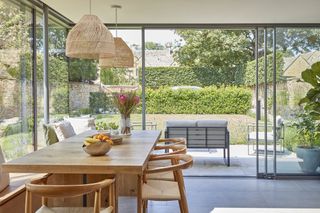 large dining area in glass box extension
