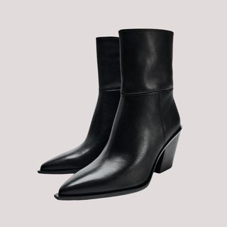 Flat lay image of black ankle boots