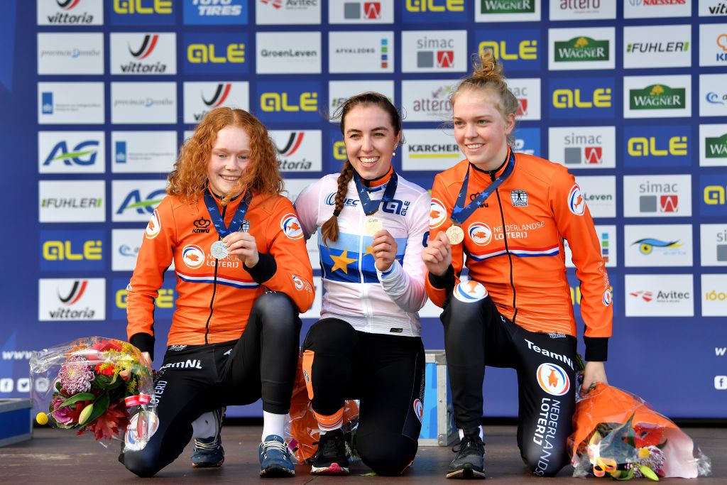 COL DU VAM DRENTHE NETHERLANDS NOVEMBER 07 LR Silver medalists Puck Pieterse of Netherlands gold medalists Shirin Van Anrooij of Netherlands and bronze medalists Fem Van Empel of Netherlands pose on the podium during the medal ceremony after the 19th UEC European Cyclocross Championships 2021 Womens U23 EuroCross21 UECcycling on November 07 2021 in Col du Vam Drenthe Netherlands Photo by Luc ClaessenGetty Images