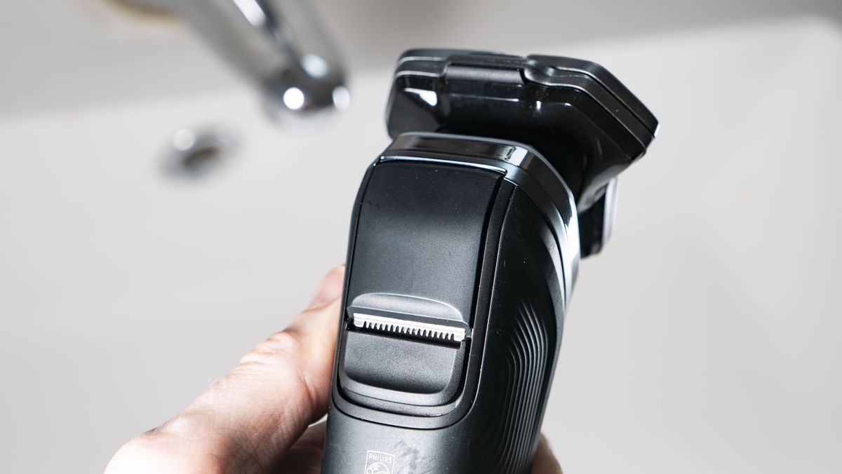 Close up of the Philips i9000 electric razor's pop-up trimmer
