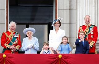 King Charles, Camilla, the late Queen Elizabeth II and the Wales family on the Buckingham Palace balcony