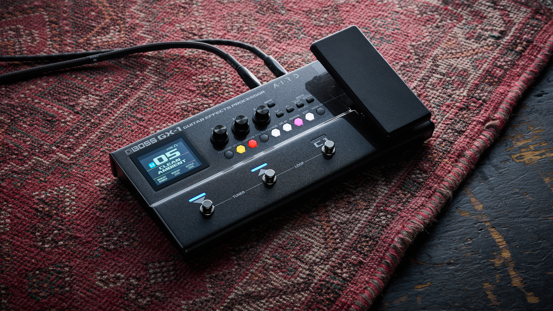 The Boss GX-1 multi-effects pedal lying on a rug