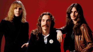 Rush posing for a photograph in the 1970s