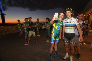 Peter Sagan poses for a selfie with a member of the Brazilian national team.