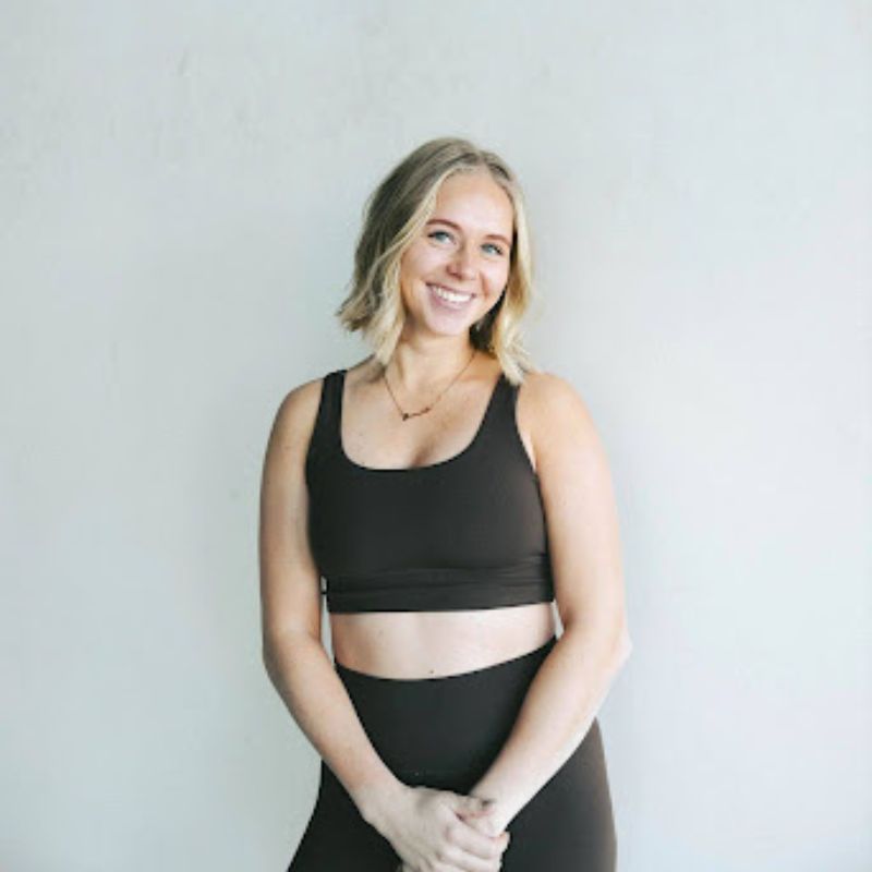female Pilates instructor poses for portrait
