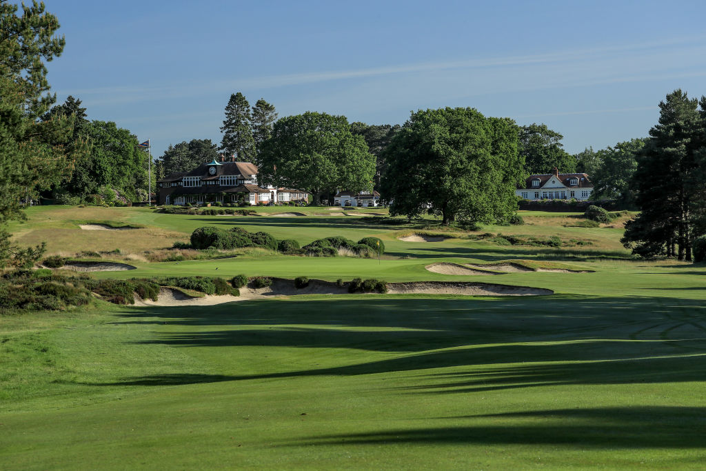 A view of the approach to the green on the par 4, 17th hole with the par 4, 18th hole on The Old Course with the clubhouse behind at Sunningdale Golf Club