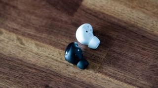 Samsung Galaxy Buds 2 Pro earbud next to Galaxy Buds Pro earbud