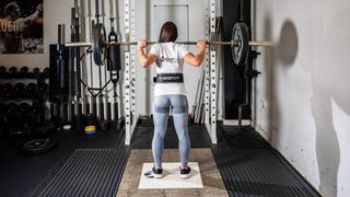 weightlifting belt 101: person performing a weight back squat while wearing a Beast Gear lifting belt