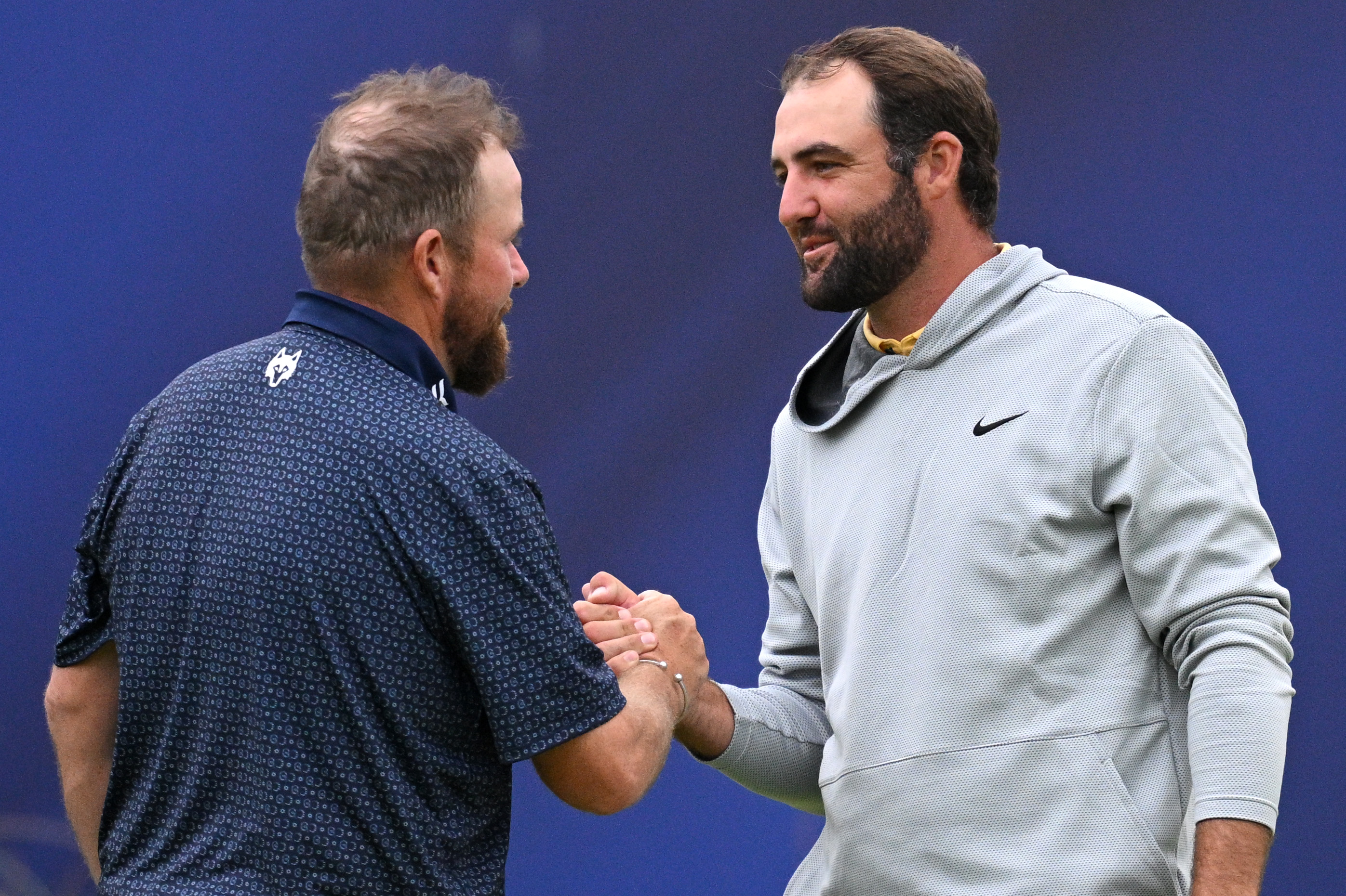 Shane Lowry and Scottie Scheffler shake hands