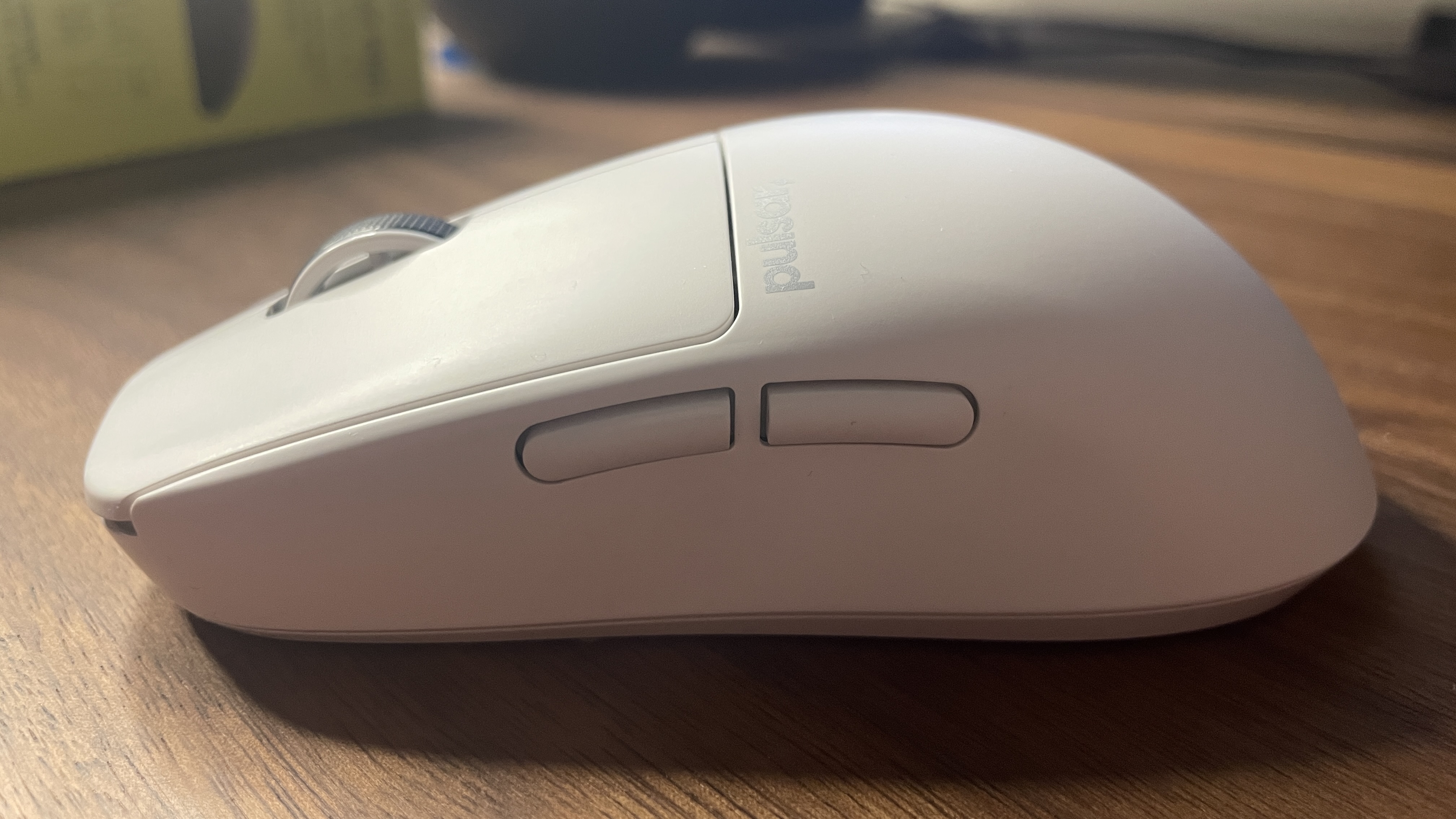 A Pulsar X2 CrazyLight Medium gaming mouse on a desk.