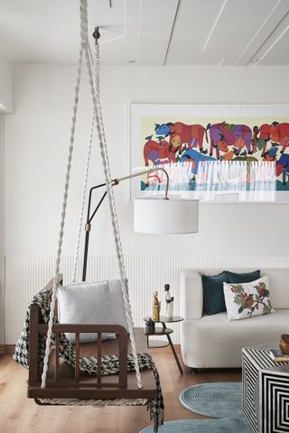 A living room with a swing chair