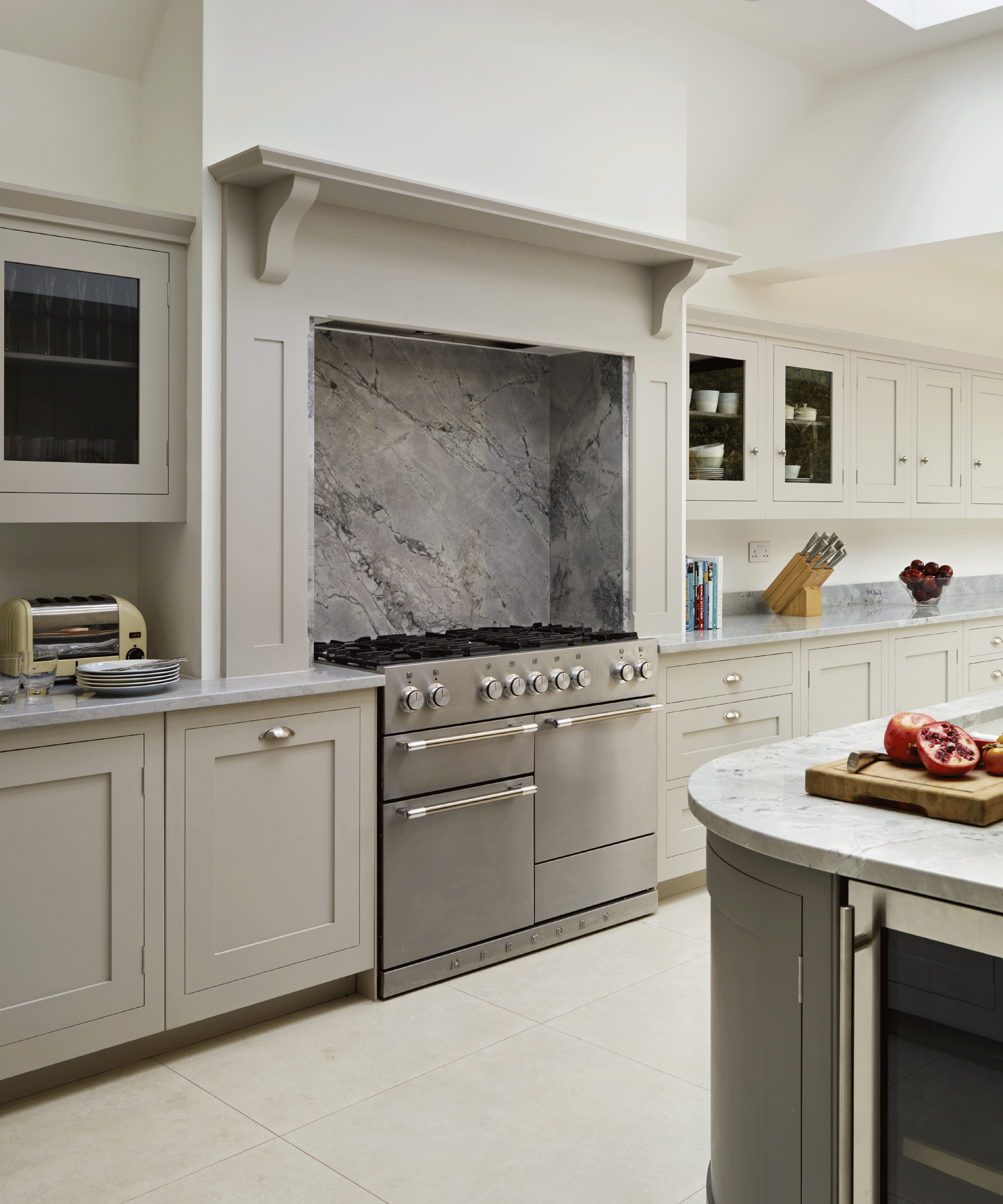 A kitchen with recessed range cooker in chimney breast