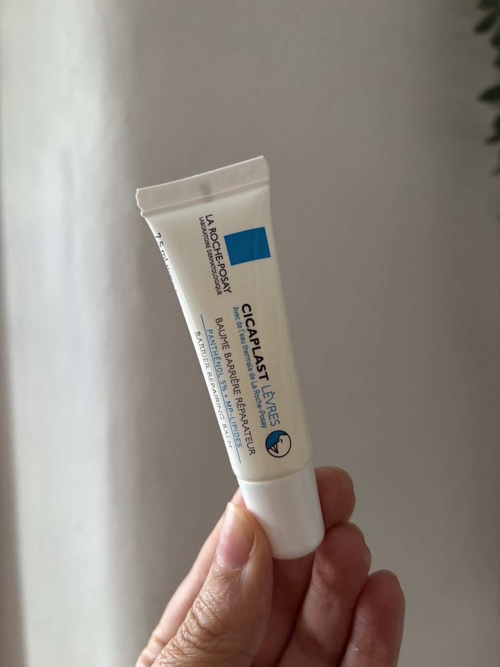 Mica Ricketts holding La Roche-Posay Cicaplast Baume Lips