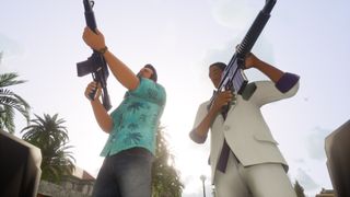 Tommy Vercetti and an NPC brandish assault rifles in Grand Theft Auto: Vice City - The Definitive Edition.
