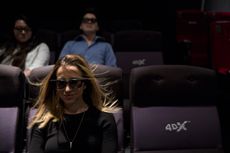 A customer watched a 4DX movie, with the wind blowing in her face.