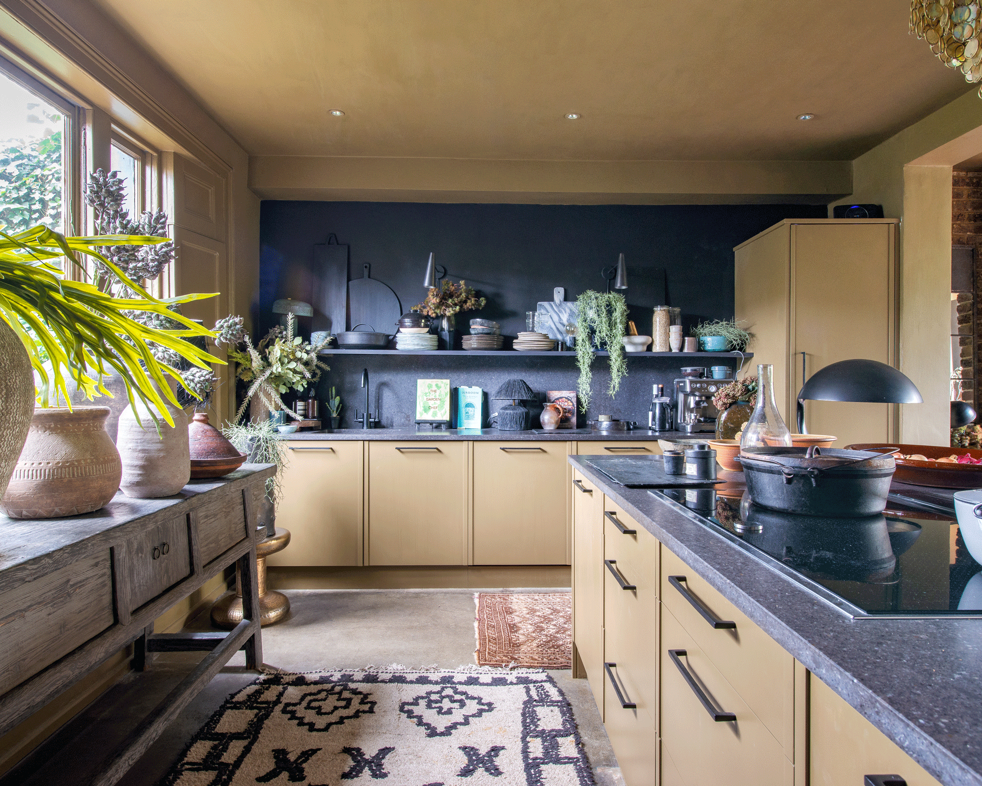 Yellow kitchen with dark walls