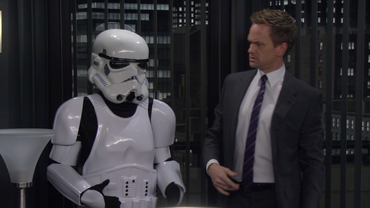 Neil Patrick Harris as Barney Stinson next to his Stormtrooper armor on How I Met Your Mother