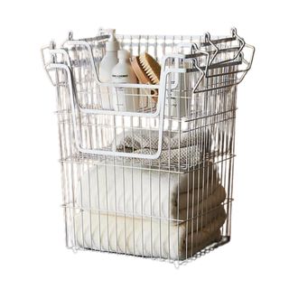 White metal stackable nest of bathroom storage baskets