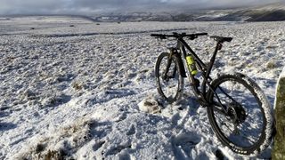 An image of a mountain bike in a snow covered field