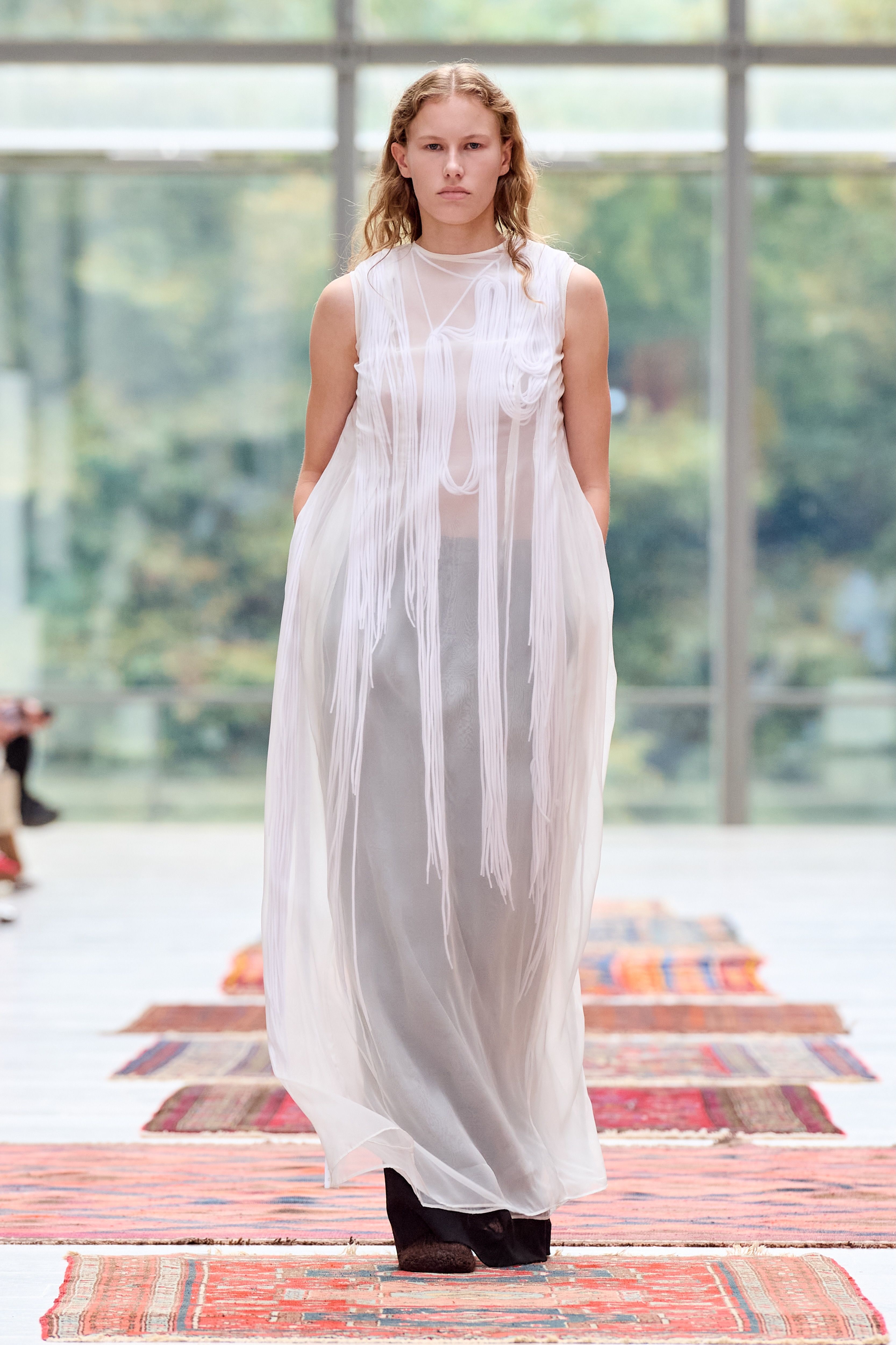 Spring 2027 Copenhagen Fashion Week looks featuring sheer layers, flowing silhouettes, and mixed prints from Anne Sofie Madsen, Institution, and Paolina Russo.