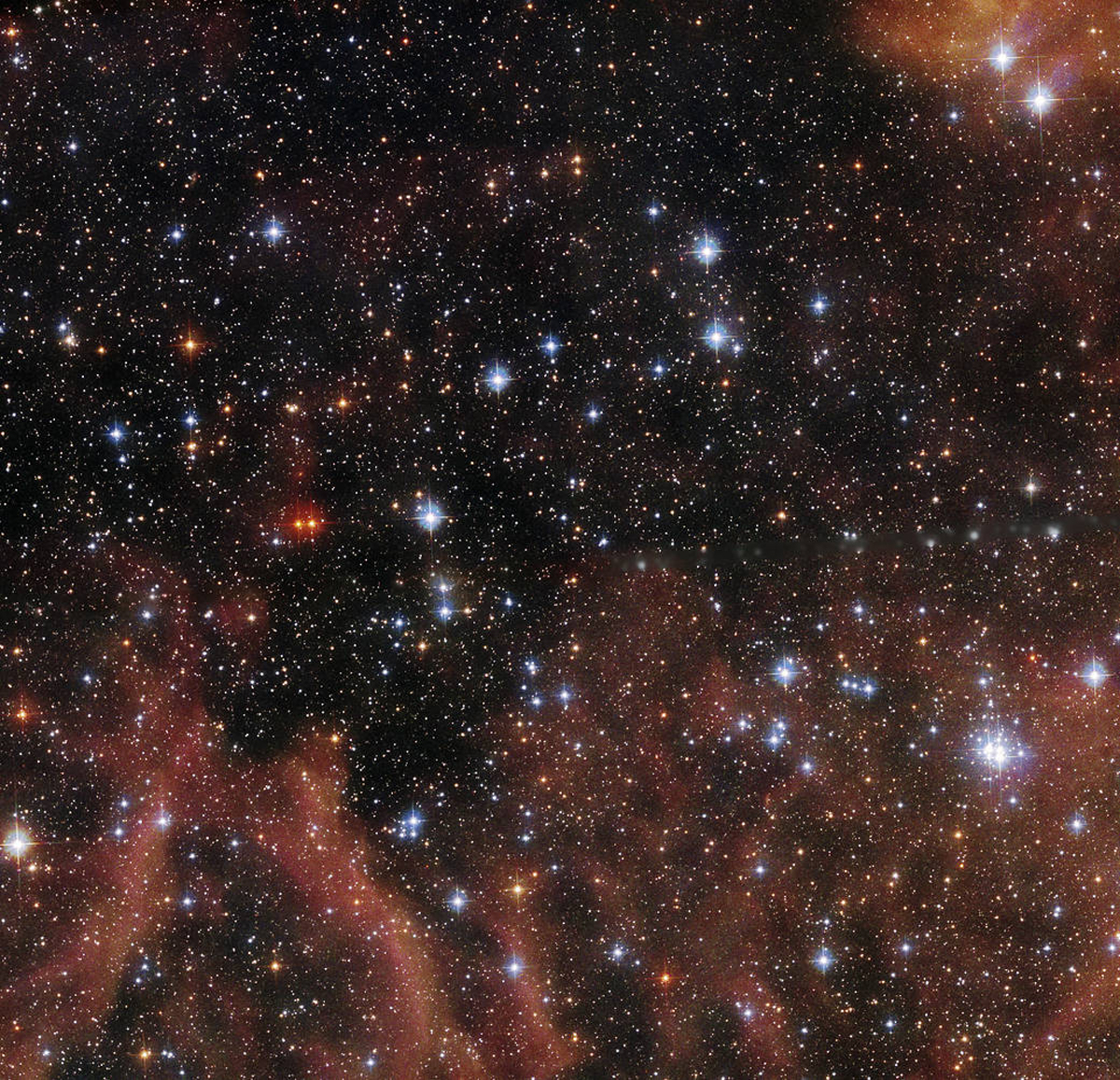 This Hubble Space Telescope image shows the open cluster BSDL 2757, located in the Large Magellanic Cloud dwarf galaxy.