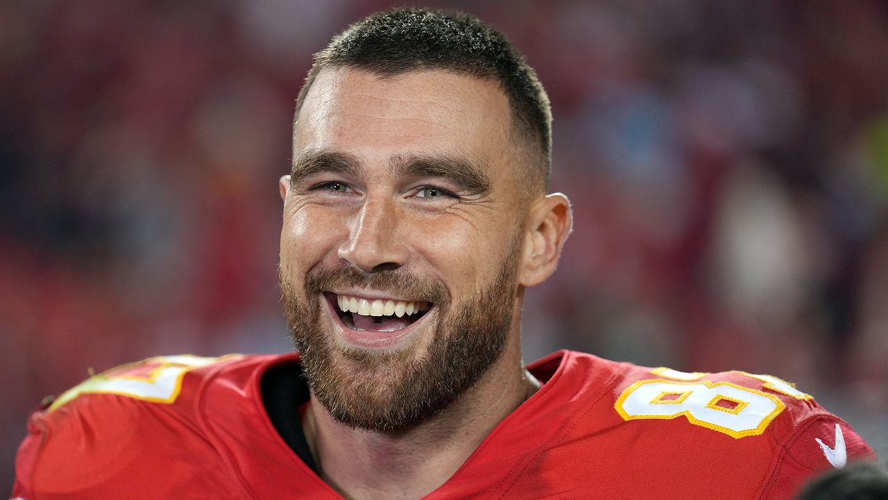 Travis Kelce smiles at a Kansas City Chiefs game