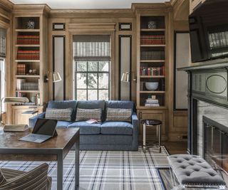 study with bookcases and plaid rug