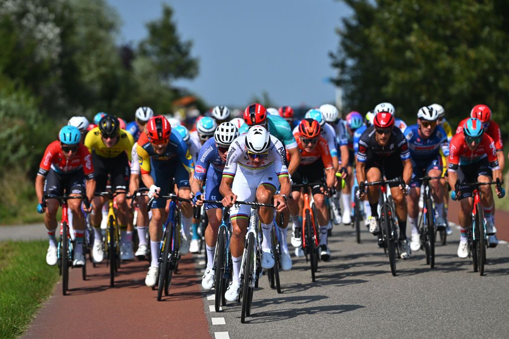 AALTER BELGIUM AUGUST 31 Mathieu Van Der Poel of The Netherlands and Team Alpecin Deceuninck leads the peloton during the 20th Renewi Tour 2024 Stage 4 a 1785km stage from Oostburg to Aalter UCIWT on August 31 2024 in Aalter Belgium Photo by Luc ClaessenGetty Images