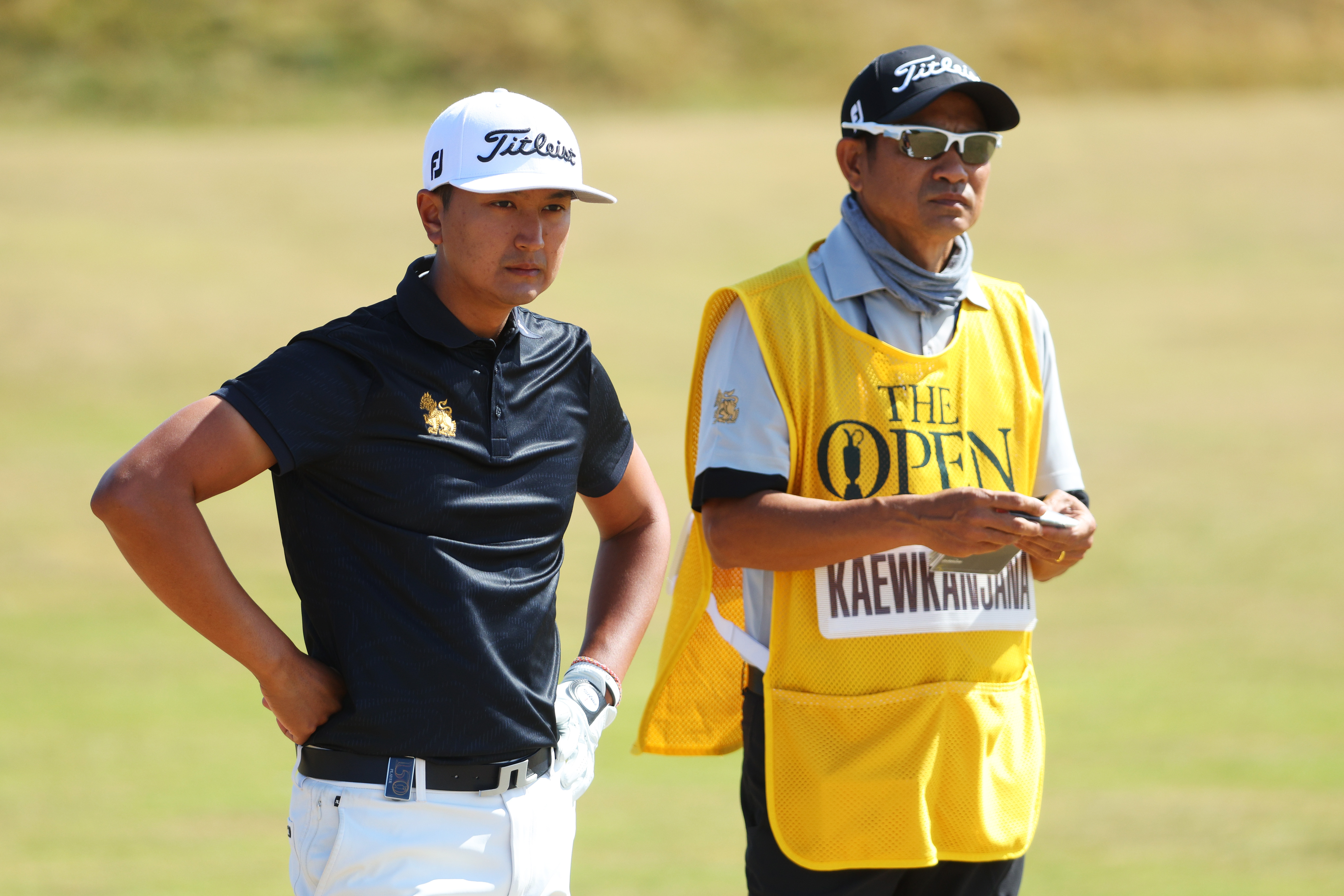 Sadom Kaewkanjana talks with his caddy