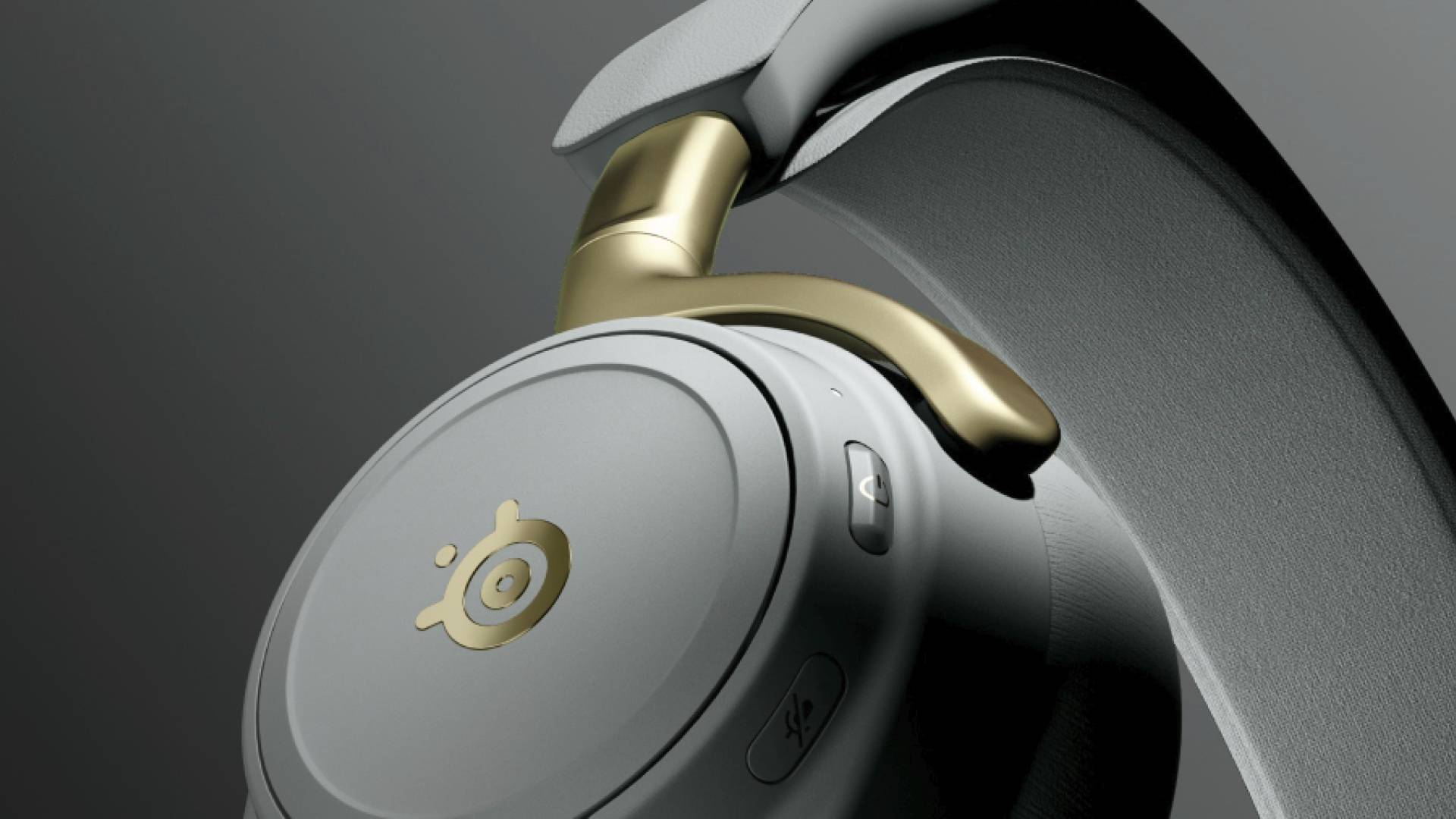 Official promo image which features a close up of a white headset cup with gold embellishments.