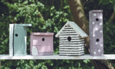 How to build a birdhouse: Line of bird houses in a garden from Pallet wood projects book by CICO Books