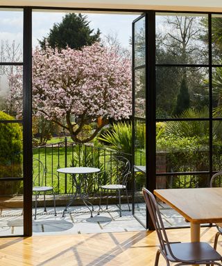 view of bistro set and blossom