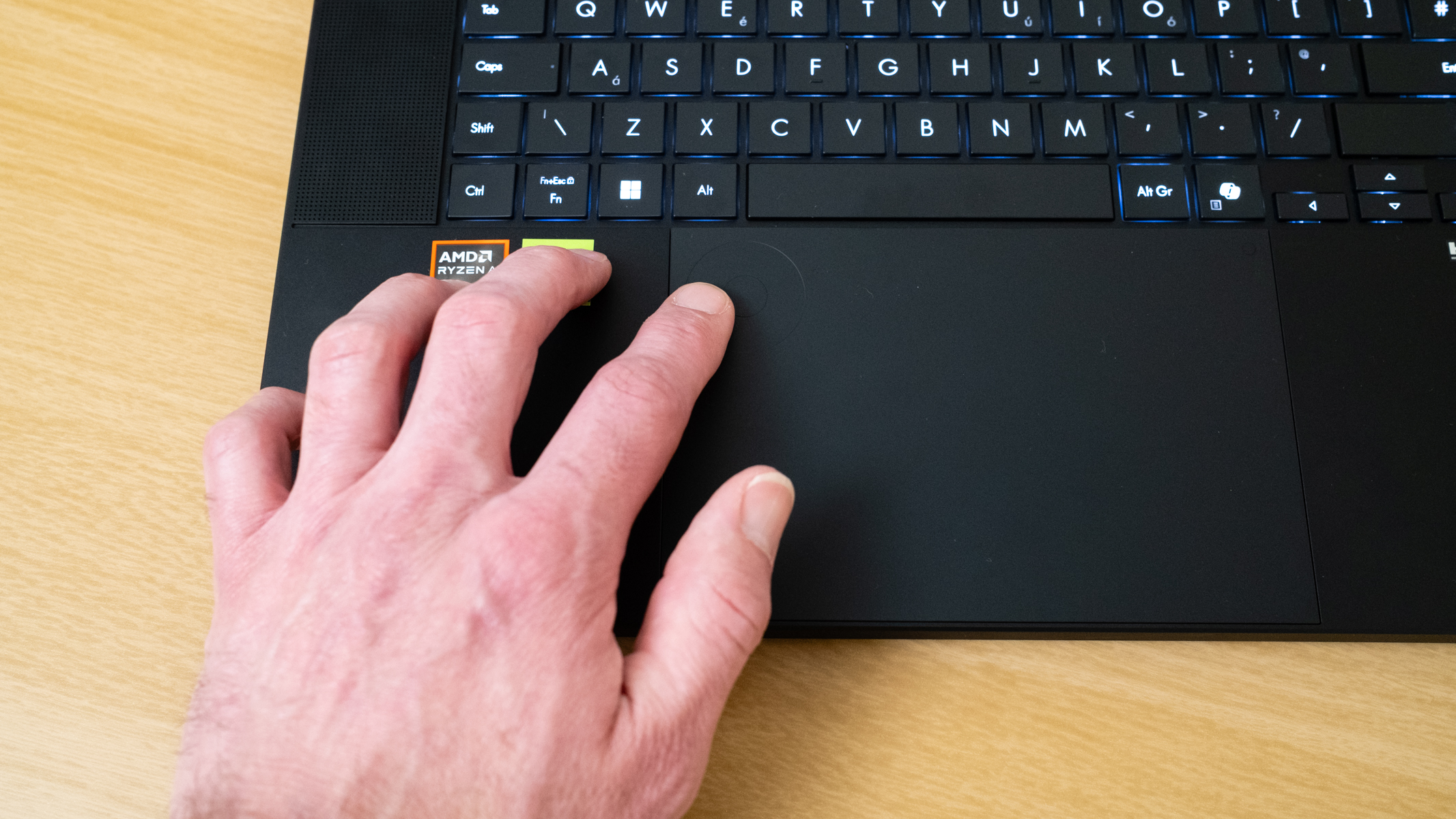 hand using the Asus Dial on the Asus ProArt P16 2025